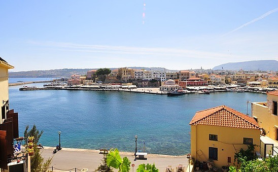 Moving to Crete, images shows sea and buildings at a distance