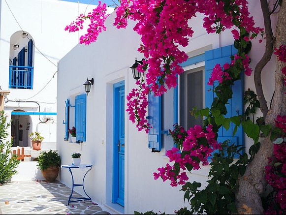 moving-to-Crete-How-to-find-a-job-blue-and-white-house-and-pink-flowers